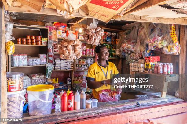 supermarket kiosk and attendant in alexandra township, johannesburg - african market stock pictures, royalty-free photos & images