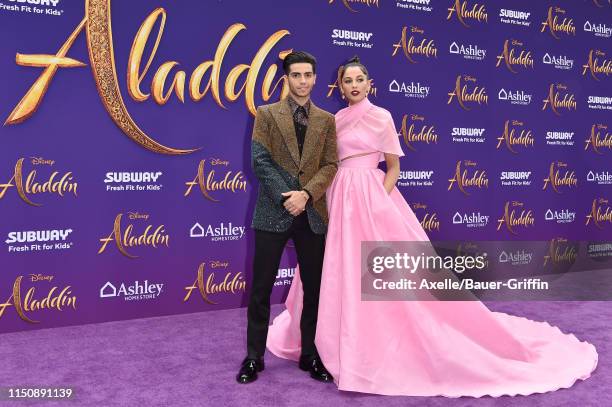 Mena Massoud and Naomi Scott attend the premiere of Disney's "Aladdin" on May 21, 2019 in Los Angeles, California.