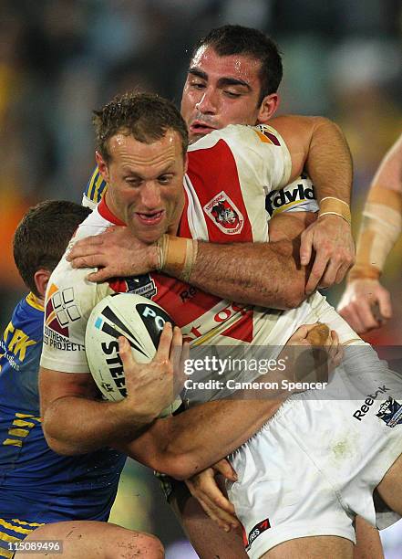 Mark Gasnier of the Dragons is tackled during the round 13 NRL match between the Parramatta Eels and the St George Illawarra Dragons at Parramatta...