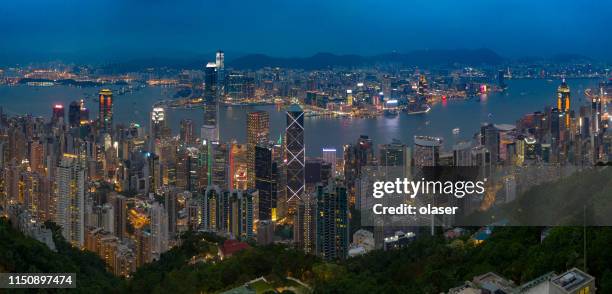 hong kong skyline cityscape by night - hong kong skyline drone stock pictures, royalty-free photos & images