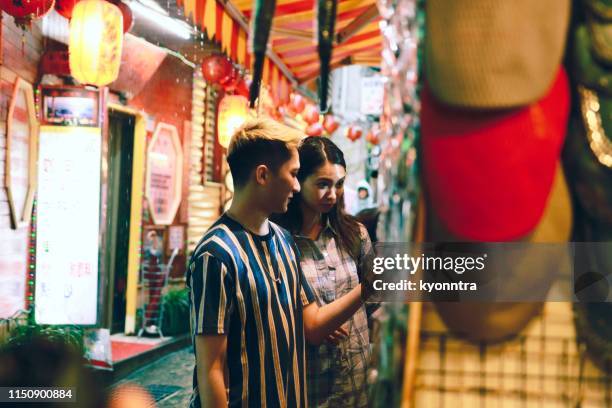 two asian couple traveling in taiwan - taiwan night market stock pictures, royalty-free photos & images