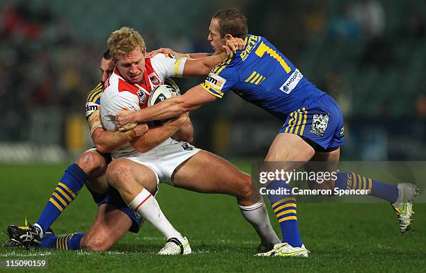 Jon Green of the Dragon is tackled during the round 13 NRL match between the Parramatta Eels and the St George Illawarra Dragons at Parramatta...