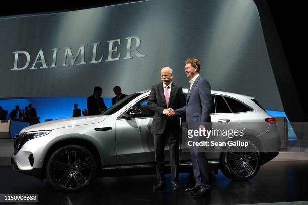 Dieter Zetsche , Chairman of Daimler AG, and Ola Källenius, who will succeed Zetsche, pose for photographers at the annual Daimler AG shareholders...