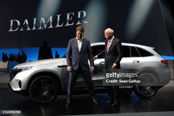 Dieter Zetsche , Chairman of Daimler AG, and Ola Källenius, who will succeed Zetsche, prepare to pose for photographers at the annual Daimler AG...
