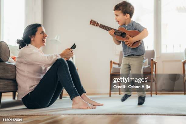 boys dancing and jumping - toddler musical instrument stock pictures, royalty-free photos & images