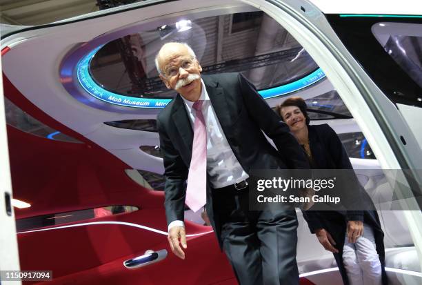 Dieter Zetsche, Chairman of Daimler AG, and his wife Anne emerge from a Daimler Vision Urbanetic van at the annual Daimler AG shareholders meeting on...
