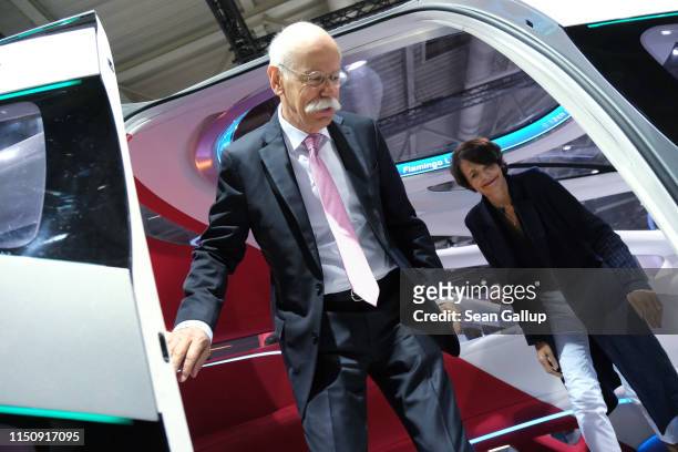 Dieter Zetsche, Chairman of Daimler AG, and his wife Anne emerge from a Daimler Vision Urbanetic van at the annual Daimler AG shareholders meeting on...
