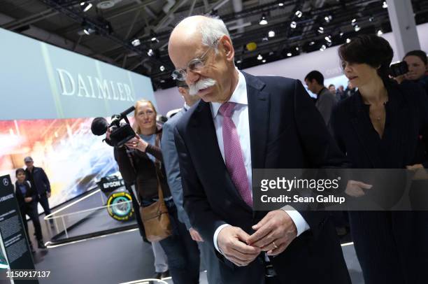 Dieter Zetsche, Chairman of Daimler AG, and his wife Anne walk among vehicles on display at the annual Daimler AG shareholders meeting on May 22,...