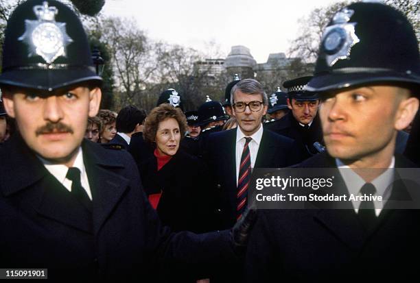 John Major and his wife Norma take a stroll through St James Park surrounded by Metropolitan police officers during the November 1990 election...