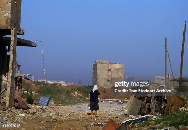 Palestinian woman photographed near the Path of Death out of the Bourj Al Barajneh refugee camp which was besieged by Amal militia gunmen during the...