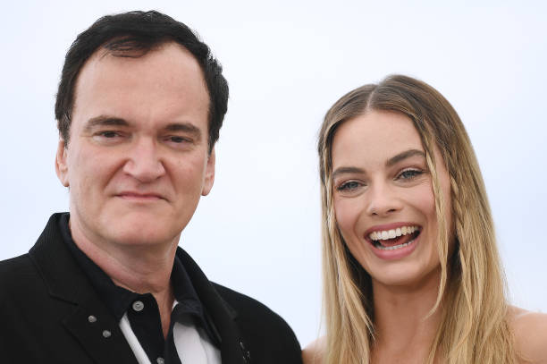 Director Quentin Tarantino and Margot Robbie attend the photocall for "Once Upon A Time In Hollywood" during the 72nd annual Cannes Film Festival on...