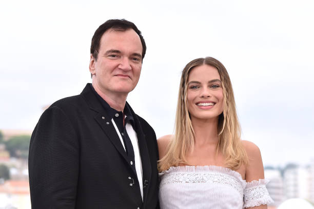 Director Quentin Tarantino and Margot Robbie attend the photocall for "Once Upon A Time In Hollywood" during the 72nd annual Cannes Film Festival on...