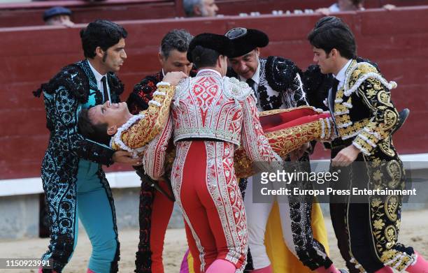 Spanish bullfighter Gonzalo Caballero receives assistant after being injured during the 8th bullfight of the San Isidro Fair at Las Ventas Bullring...