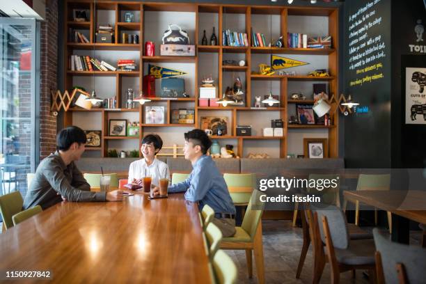 friends have a converstation and drink coffee in a coffee shop - taipei tea stock pictures, royalty-free photos & images