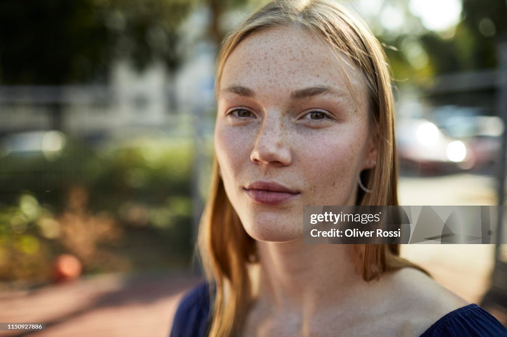 Portrait of confident young woman outdoors