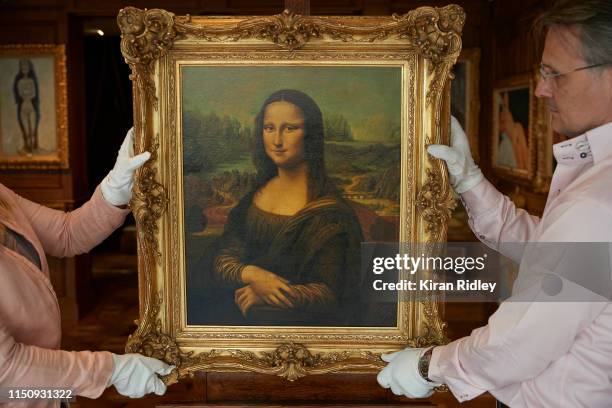 Christophe Petyt and Pauline Lepreux hang a copy of Leonardo Da Vinci’s Mona Lisa, the centre piece in an exhibition of fake masterpieces at the...