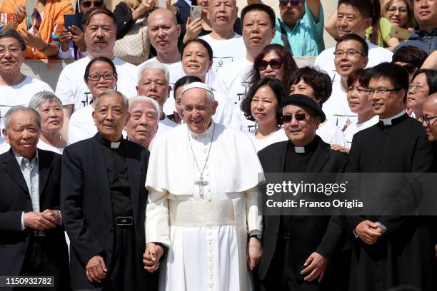 Pope Francis poses with a group of pilgrims from China during his weekly audience in St. Peter's Square on May 22, 2019 in Vatican City, Vatican.