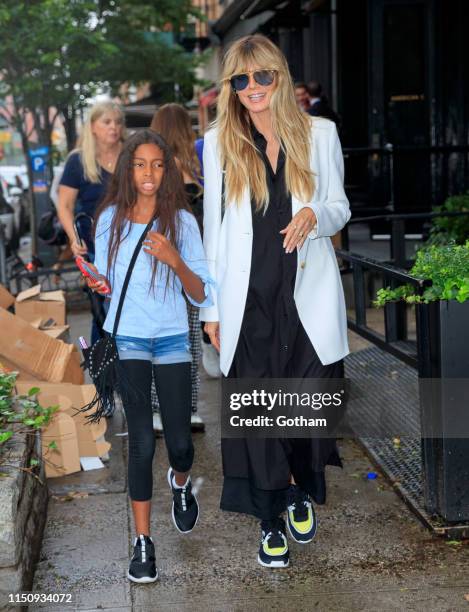 Heidi Klum walks to dinner with her kids on June 19, 2019 in New York City.