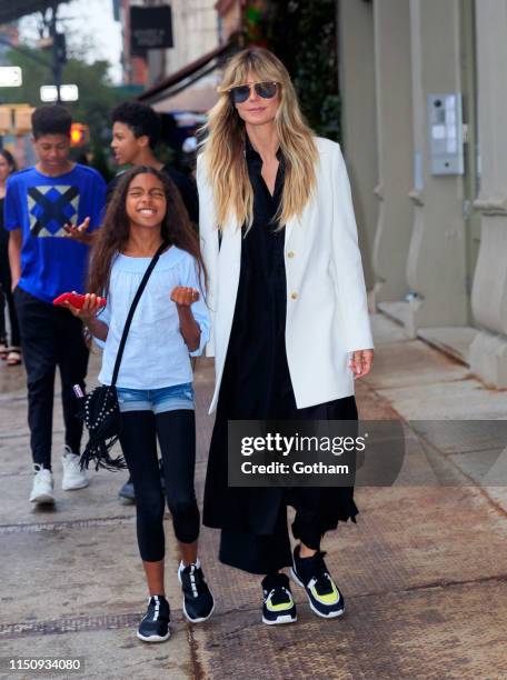 Heidi Klum walks to dinner with her kids on June 19, 2019 in New York City.