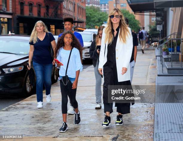 Heidi Klum walks to dinner with her kids on June 19, 2019 in New York City.