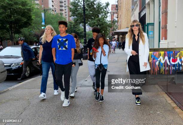 Heidi Klum walks to dinner with her kids on June 19, 2019 in New York City.