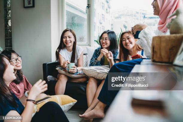 friends talking and drinking coffee at home - vietnamese stock pictures, royalty-free photos & images