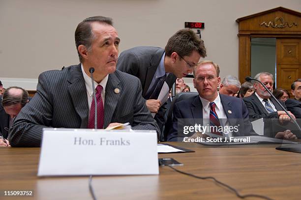 May 31: Rep. Trent Franks, R-Ariz., and Rep. Jim Langevin, D-R.I., right, talking to an aide, prepare to testify during the House Energy and Commerce...