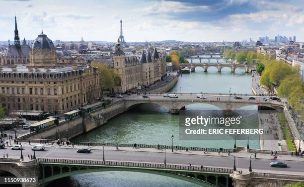 This picture taken on April 25, 2019 in Paris shows an aerial view of the Seine river banks, the Notre Dame Bridge , the Sainte-Chapelle , the...
