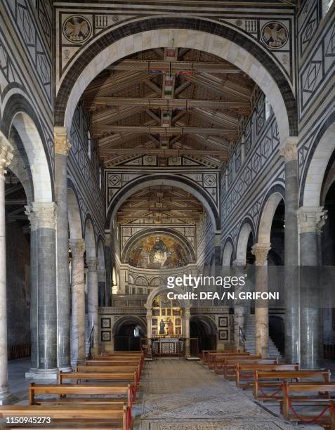 Nave of basilica of San Miniato al Monte with Chapel of the Crucifix by Michelozzo di Bartolomeo , Florence , Tuscany, Italy, 15th century.