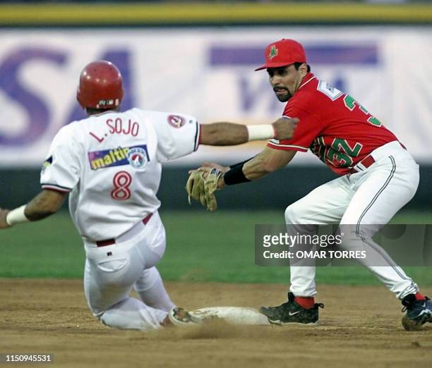Carlo Rodriguez , second baseman for Mexico strikes out Luis Sojo, player on the Cardenales de Lara, in the Caribbean Series game 05 February 2001 in...