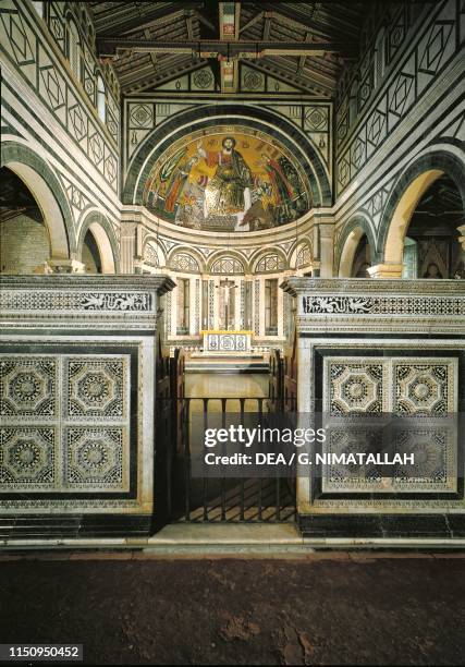 Apse with mosaic of Redeemer between Virgin Mary and St Minias basilica of San Miniato al Monte , Florence , Tuscany. Italy, 13th century.