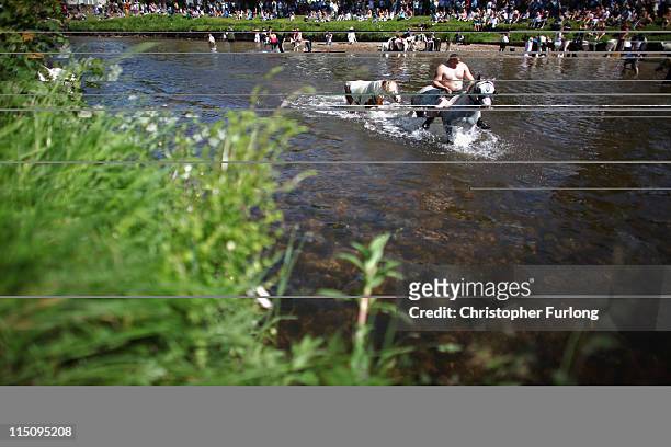 Travellers wash their horses in the River Eden in preparation for selling at the Appleby Horse Fair on June 3, 2011 in Appleby, England. Appleby...