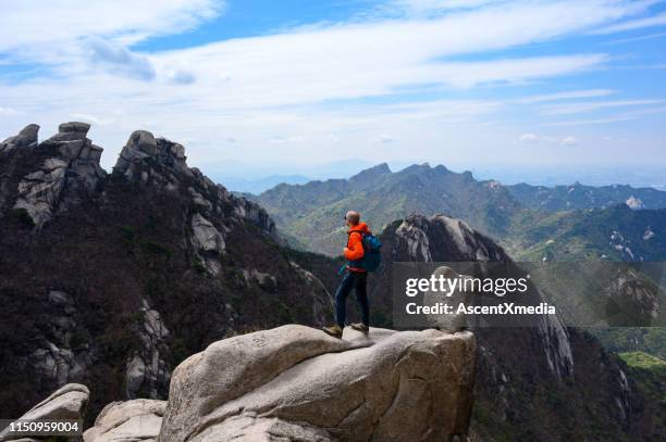 male hiker enjoying natures beauty at bukhansan national park, korea - seoul stock pictures, royalty-free photos & images