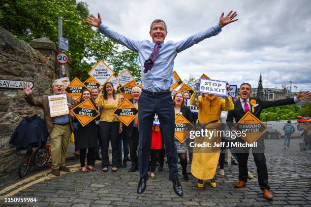 Scottish Liberal Democrat leader Willie Rennie does a star jump as he attends a rally, with activists and campaigners on May 22, 2019 in...