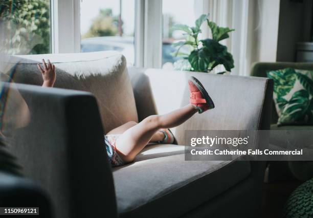 little hand and feet - shoe chair stock pictures, royalty-free photos & images