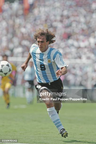 Argentine professional footballer Gabriel Batistuta, striker with Fiorentina, pictured making a run with the ball during play between Romania and...