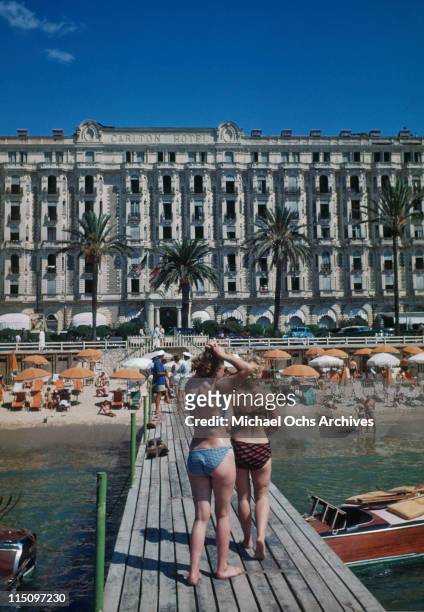 Sunbathers on a deck in front of the beach outside the Carlton Hotel in Cannes, France in September 1948.