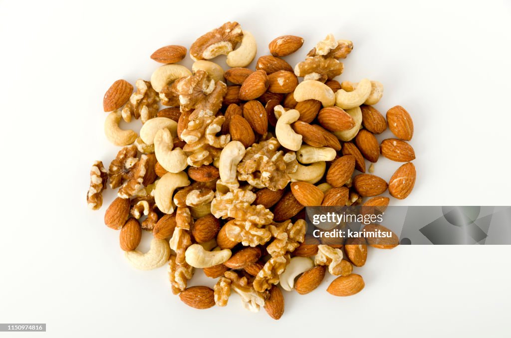 Mixed nuts on a white background.