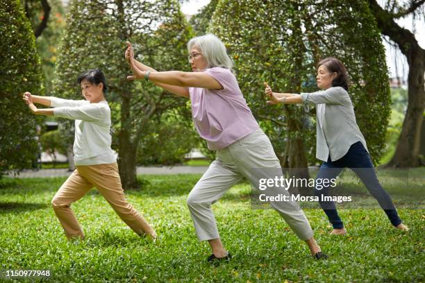 coach giving self-defense training to friends - self defence stock pictures, royalty-free photos & images