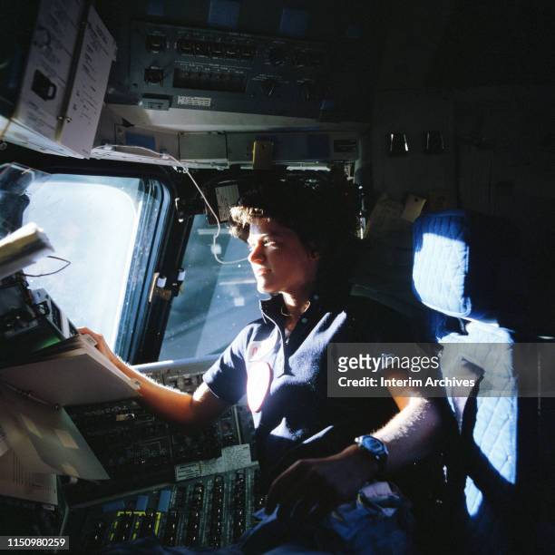 View of American astronaut Sally Ride in the cockit of the NASA space shuttle Challenger, June 1983.