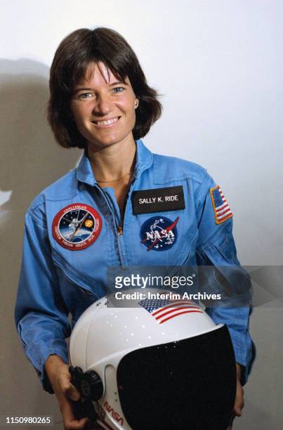Portrait of American astronaut Sally Ride as she poses, with a helmet in her hands, at the Johnson Space Center, Houston, Texas, 1983. At the time,...