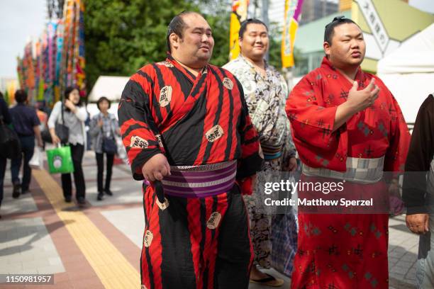 Sumo wrestlers are seen wearing colorful traditional yukata kimono outside the Grand Sumo Tournament on May 22, 2019 in Tokyo, Japan.