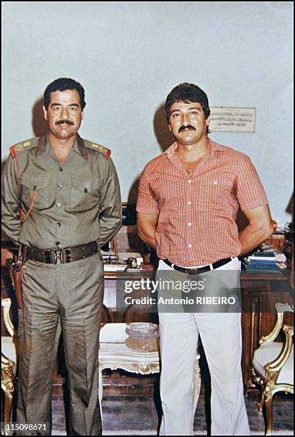 Saddam's artists in Baghdad, Iraq in July, 1994 - Souhall Al Hindawe with Saddam Hussein.