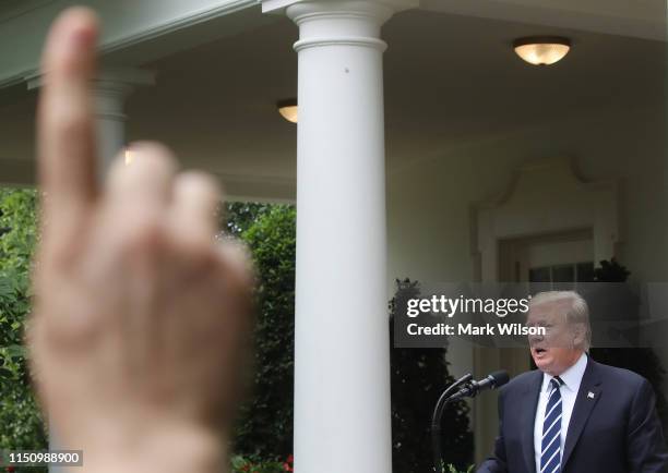 President Donald Trump speaks about Robert Mueller's investigation into Russian interference in the 2016 presidential election in the Rose Garden at...