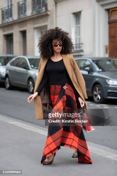 Model Leila Depina wears a Zara skirt with a Chanel pin, Chanel bags,  News Photo - Getty Images