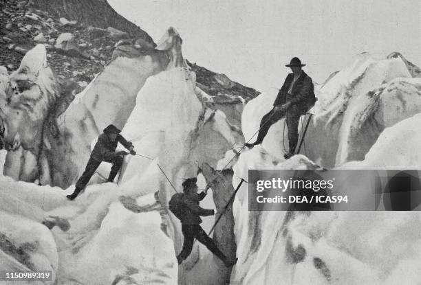 Mountaineers crossing a crevasse on the Agentiere Glacier, Mount Blanc Alps, France, photo from Album dell'Illustrazione Popolare, No 33, August 15,...