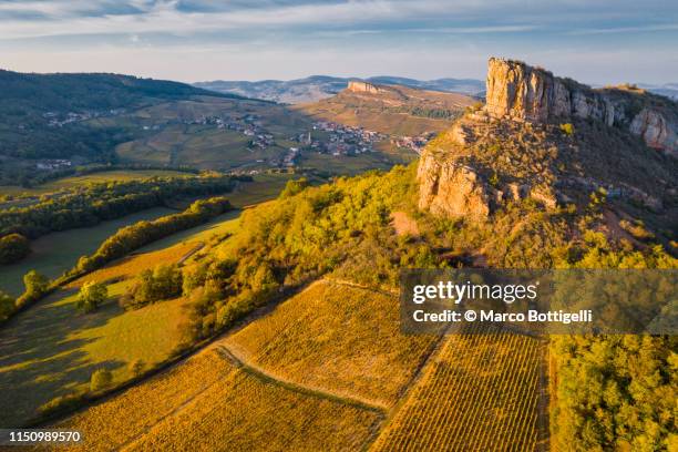 aerial view of rock of solutre at sunset, burgundy, france - escarpment stock pictures, royalty-free photos & images