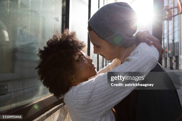 20-something hipster couple in the city - black women kissing white men stock pictures, royalty-free photos & images