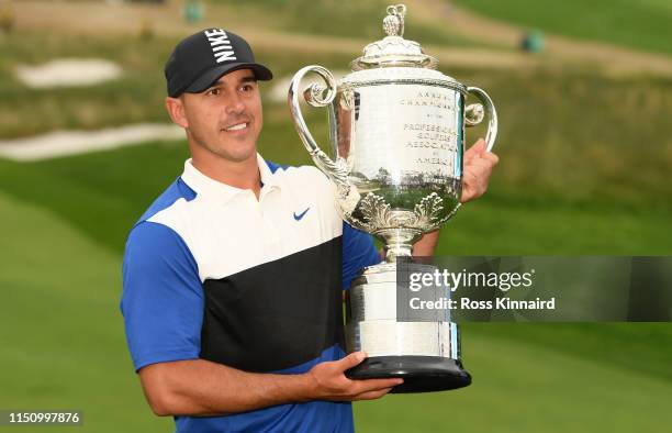 Brooks Koepka of the United States poses with the Wanamaker Trophy during the Trophy Presentation Ceremony after winning the final round of the 2019...