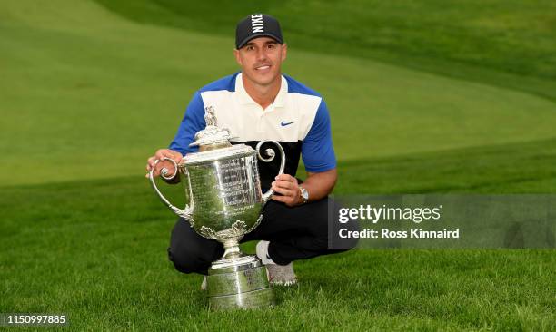 Brooks Koepka of the United States poses with the Wanamaker Trophy during the Trophy Presentation Ceremony after winning the final round of the 2019...